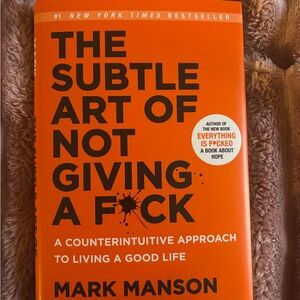 The Subtle Art of Not Giving a F*ck by Mark Manson - Orange Cover